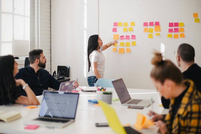 Team discussing a digital project around a table